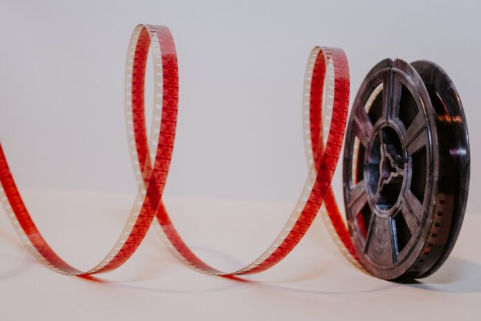 Photo by Denise Jans a close up of a reel of film